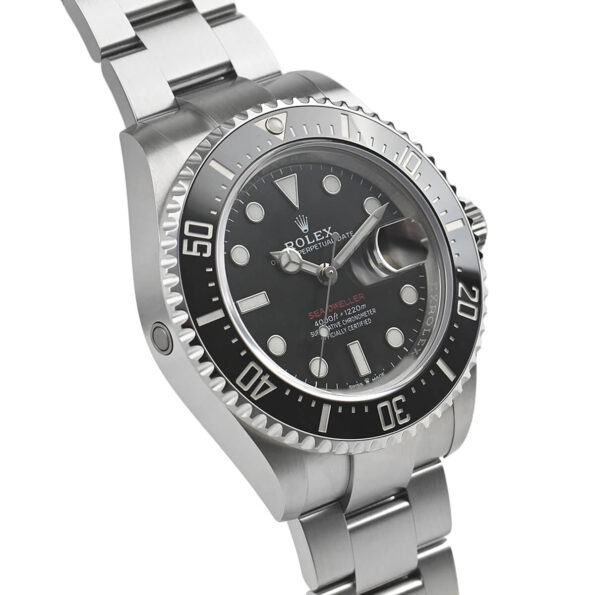 A close-up of the Rolex Sea-Dweller 126600-0001’s Oyster bracelet with brushed and polished stainless steel links, featuring the Glidelock extension system for easy adjustment over a diving suit.