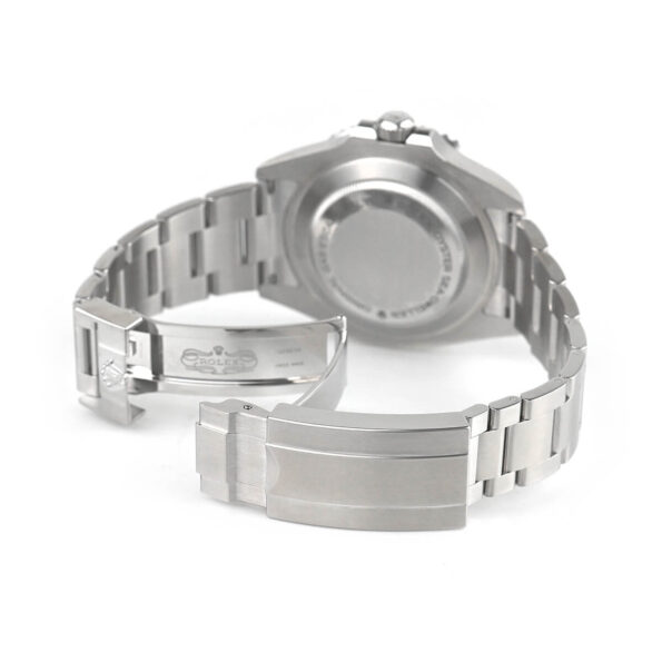 The solid stainless steel case back of the Rolex Sea-Dweller 126600-0001, engraved with 'Rolex Oyster Original Gas Escape Valve,' highlighting its deep-sea diving capabilities and robust construction.